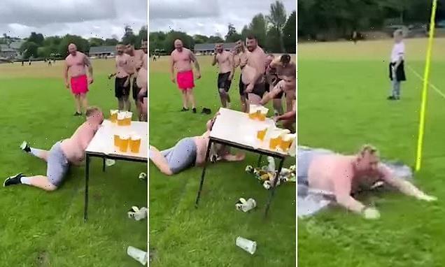 Moment rugby player sends pints FLYING during &apos;beer slide challenge&apos;