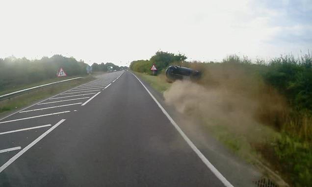 Shocking moment car crashes into ditch after overtaking lorry