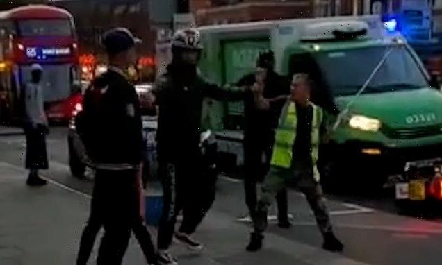 Road rage Asda driver held back as he attacks motorcyclist with A POLE