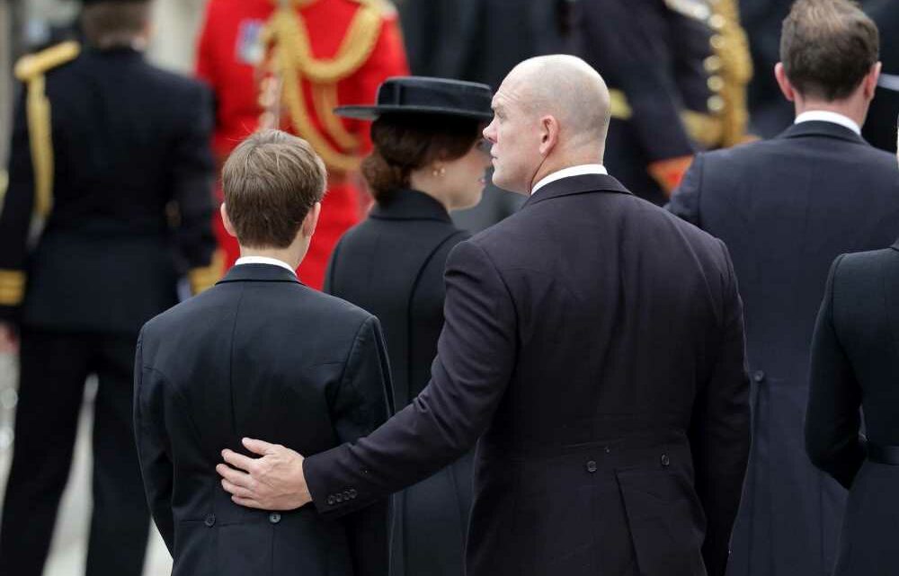 Touching moment Queen’s youngest grandson James, 14, is comforted by uncle Mike Tindall at Queen's funeral | The Sun
