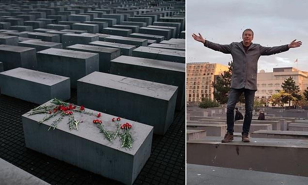 Far-right German politician DANCES on Holocaust memorial