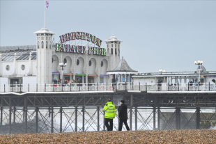 Massive search launched after reports a person is swept out to sea at Brighton Pier as rough waves pummel coast | The Sun