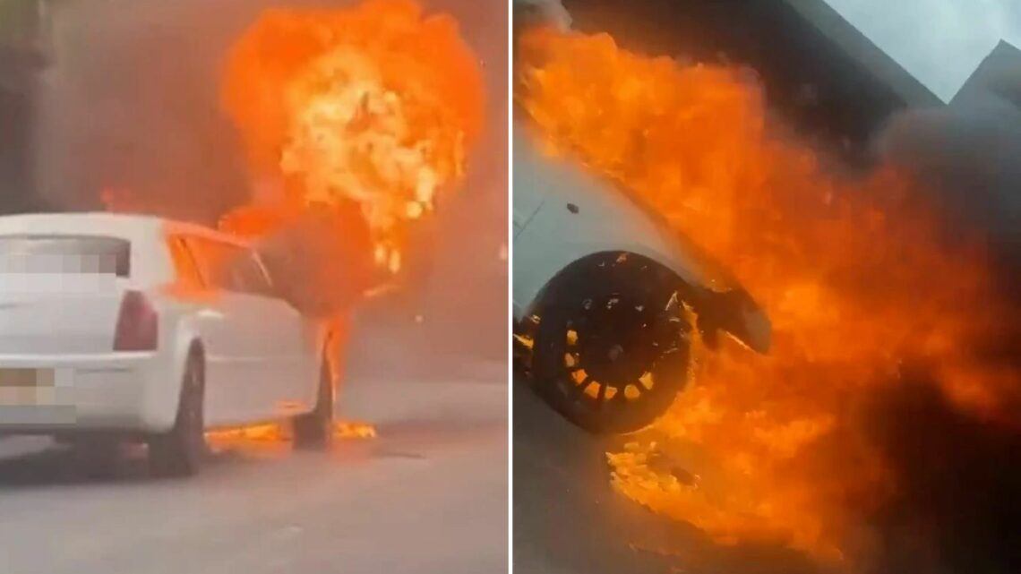 Dramatic moment a limousine bursts into flames after breaking down in the middle of a busy motorway | The Sun