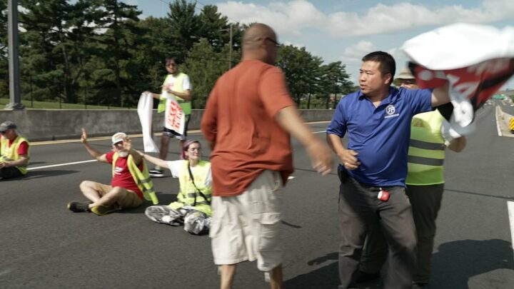 Furious commuters rip banners from climate activists blocking roads