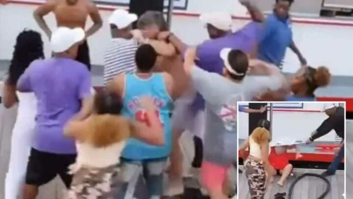 Massive WWE-style brawl breaks out on Alabama waterfront as woman smashed over head with folding chair in parking row | The Sun