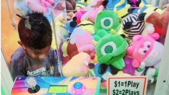 Mischievous toddler, 3, gets stuck in a claw machine